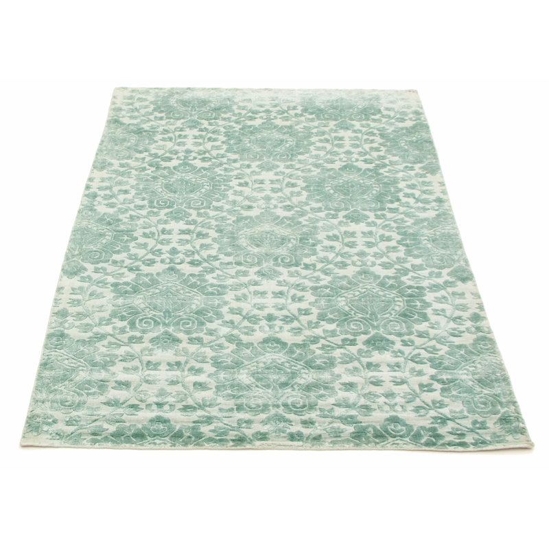 Tapis vert / ivoire tissé à la main