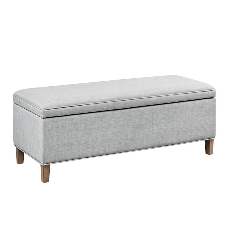 Banc rectangulaire avec coussin gris et pieds en bois massif pour un espace de rangement spacieux