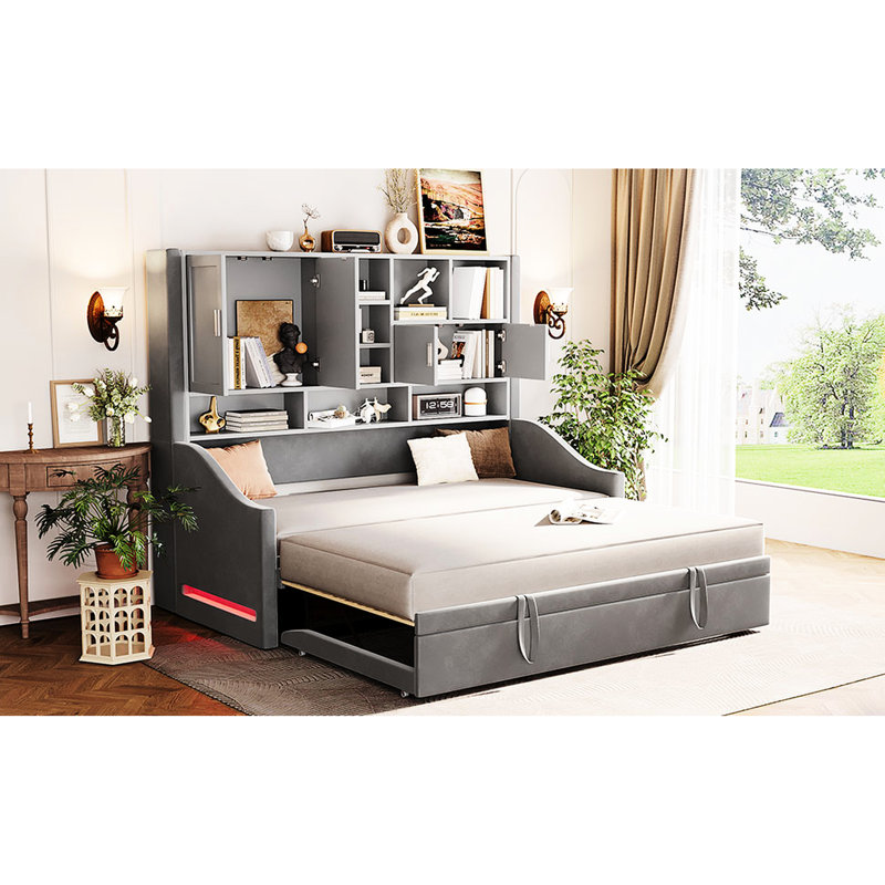 Lit de jour gris avec accoudoirs à DEL, tablettes de rangement et lit gigogne escamotable, conception orientée confort, lueur ambiante pour une atmosphère relaxante, idéal pour accueillir des invités