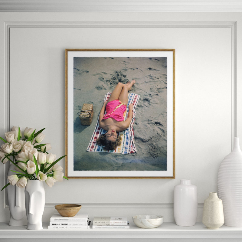Pat Hall Lying on Beach Framed, 39" H x 33" W x 2.75" D, Brown