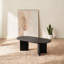 Table basse ovale avec finition noire élégante et base piédestal, conception compacte moderne pour les petits espaces