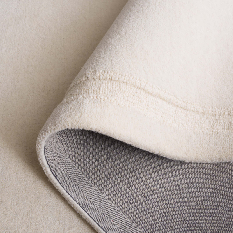 Sopheia Hand Tufted Wool Cotton Solid Color Rug in Ivory, Rectangle 5' x 8'
