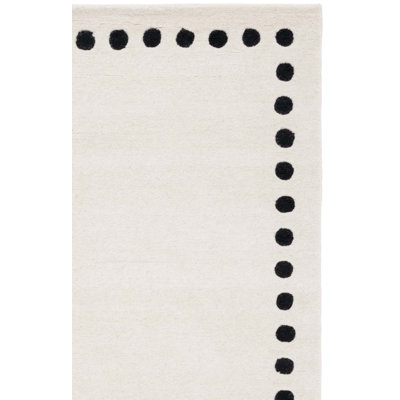 Lexy Polka Dots Handmade Tufted Cotton/Wool Area Rug in Ivory/Black