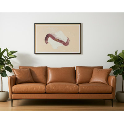 86" Tan Leather Sofa And Toss Pillows With Black Legs