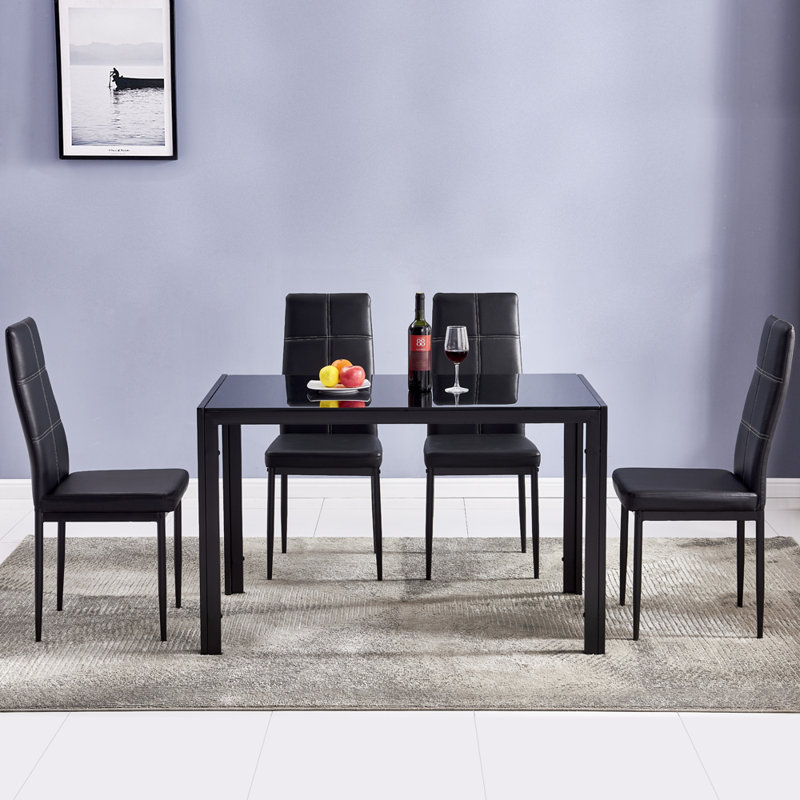 Table de salle à manger rectangulaire 4 places en verre trempé et tube de fer noir (chaises non incluses)