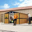 Remise de rangement extérieure en métal 10 x 12 pi avec portes verrouillables, 2 fenêtres, bouches d'aération et toit incliné