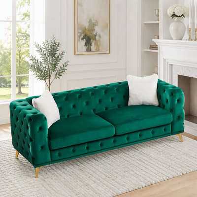 Canapé en velours de style Chesterfield avec détails capitonnés et pieds en métal
