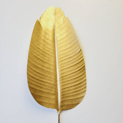 Faux arbres et feuilles de bananier doré