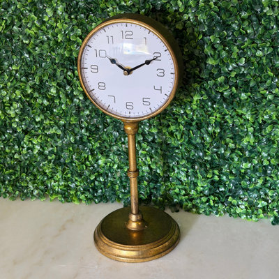 Vintage antique gold metal pedestal table clock with white analog dial, 15 inches high