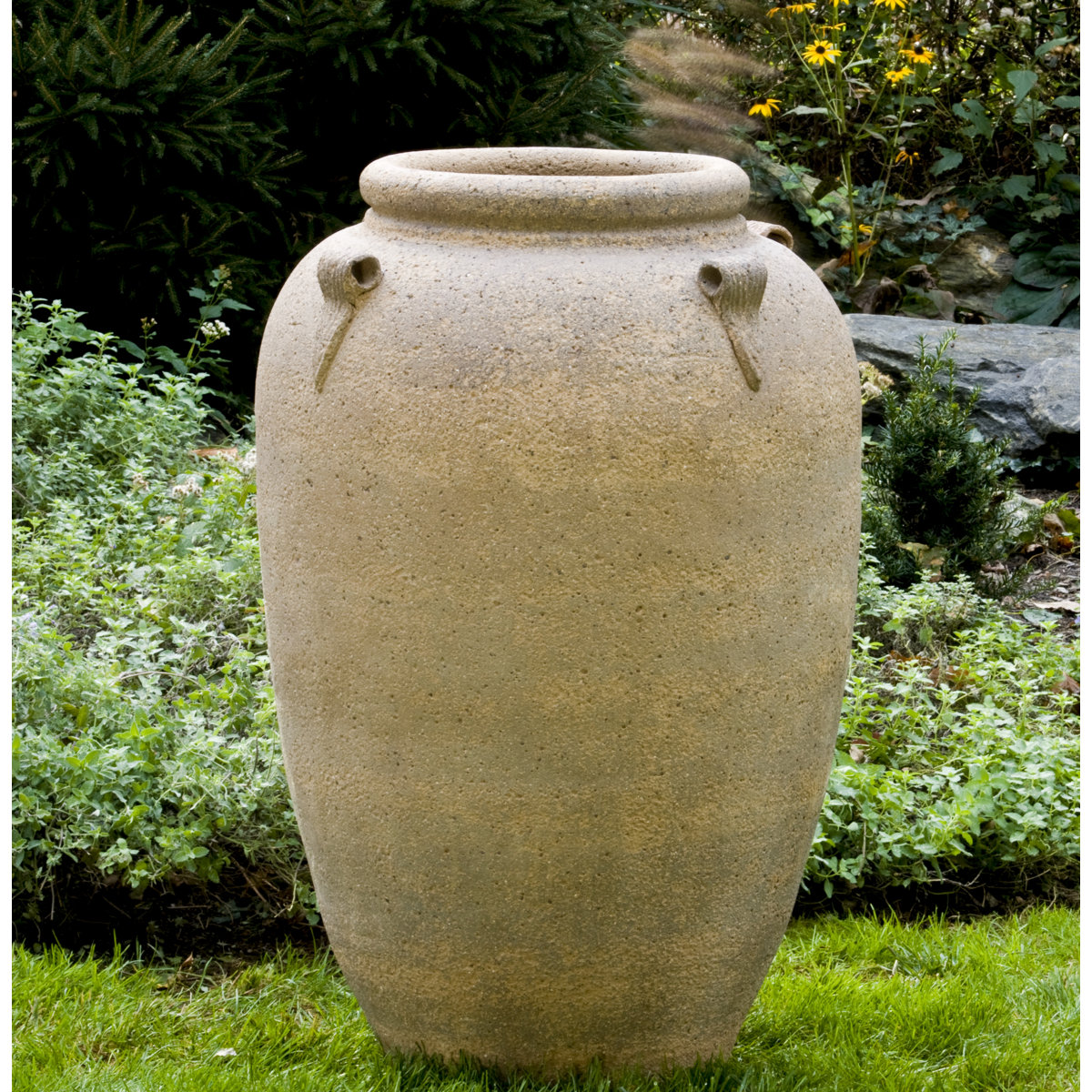 Terracotta pot planter with a rounded handmade shape and warm clay finish for a cowgirl coastal front porch