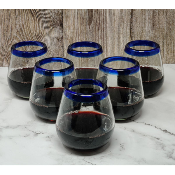 https://assets.wfcdn.com/im/92410449/resize-h600-w600%5Ecompr-r85/2495/249586543/Hand+Blown+Mexican+Stemless+Wine+Glasses+-+Glasses+With+Cobalt+Blue+Rims+%2815+Oz%29+%28Set+of+4%29.jpg
