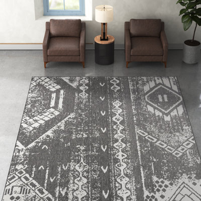 Tapis intérieur / extérieur gris anthracite / blanc en polypropylène tissé à la machine Wilmslow