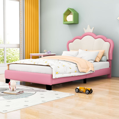 Lit plateforme tapissier avec tête de lit en forme de couronne