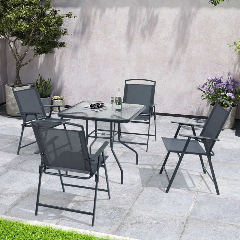 Spirit 4 - Person Patio Dining Set with Unbrella Hole and Folded Chairs, Gray