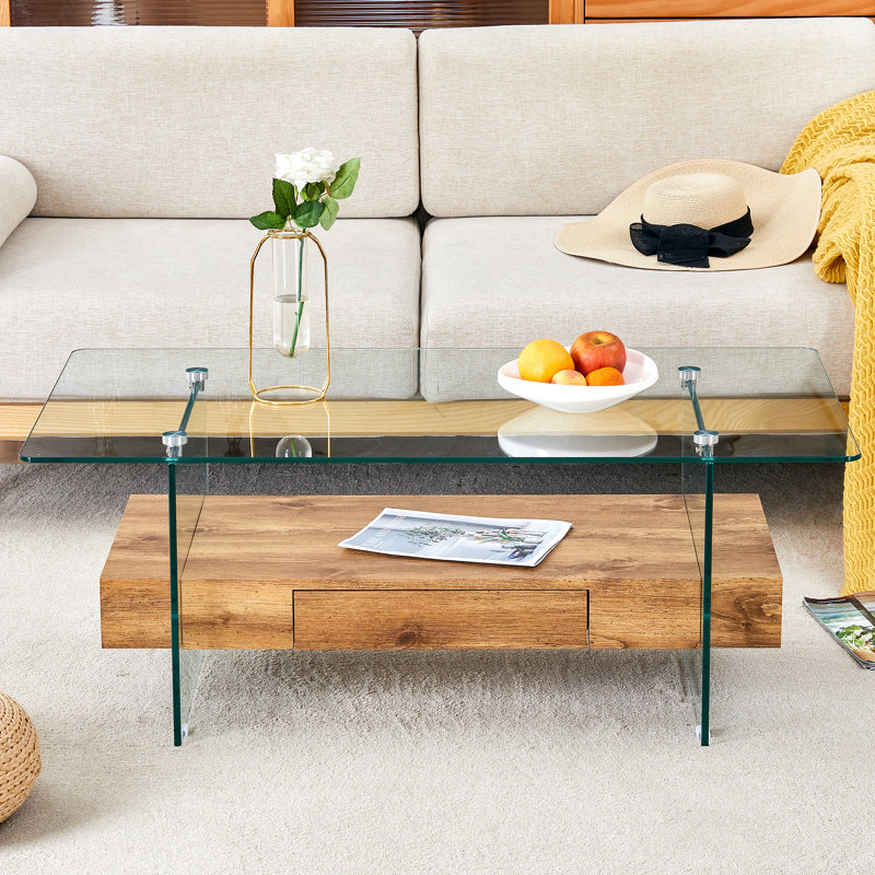 Table basse moderne à deux niveaux de 43,3 pouces - Verre trempé transparent et texture grain de bois, conception de rangement multifonctionnelle. L'étage inférieur comprend un tiroir. Peut être utilisé comme table basse, table d'appoint, etc.