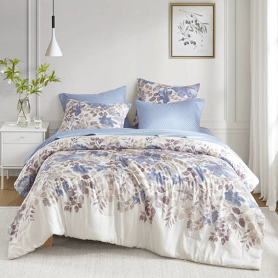 Édredon et drap bleu floral