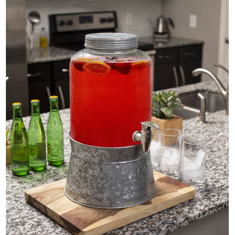 https://assets.wfcdn.com/im/92462969/resize-h755-w755%5Ecompr-r85/1323/132342681/August+Grove%C2%AE+2.5+Gallon+Pebbled+Glass+Beverage+Dispenser+With+Galvanized+Stand+-+Lid+-+Spigot+-+Decorative+Round+Jar+For+Drinks+-+Lemonade+Sangria+Tea+Water+Drink+Jar+Jug+-+Home+Parties.jpg