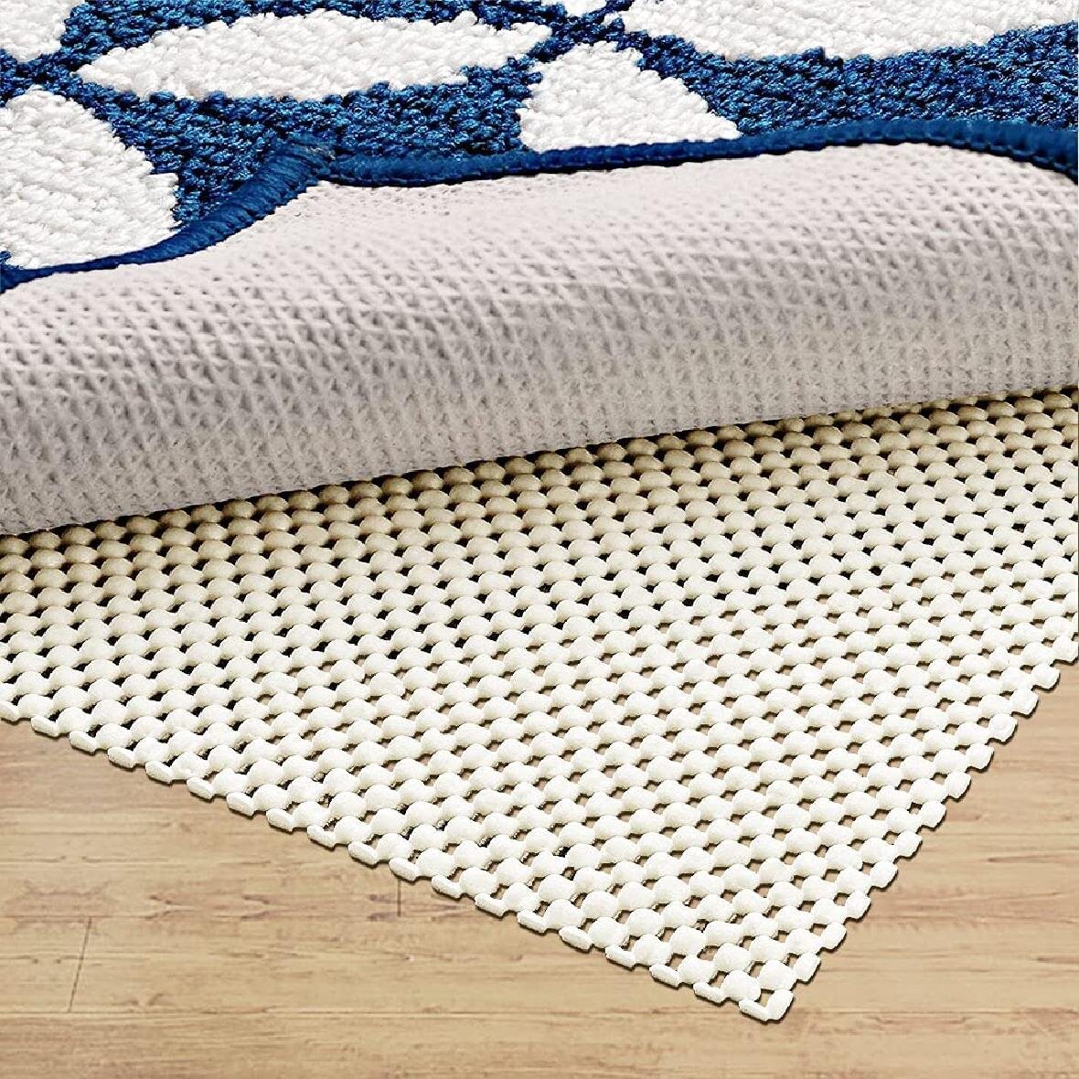 https://assets.wfcdn.com/im/92470826/compr-r85/1690/169059611/gavan-09-thick-non-slip-rug-pad.jpg