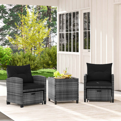Winston Porter 5 Piece Patio Rattan Furniture With 2 Ottomans & Tempered Glass Coffee Table Black