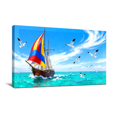 Voilier nautique et de plage avec voile colorée et mouettes