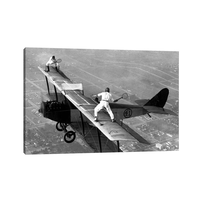 Playing Tennis On A Biplane In 1925 by Unknown Artist - Wrapped Canvas Print, 20.32 cm H x 30.48 cm W