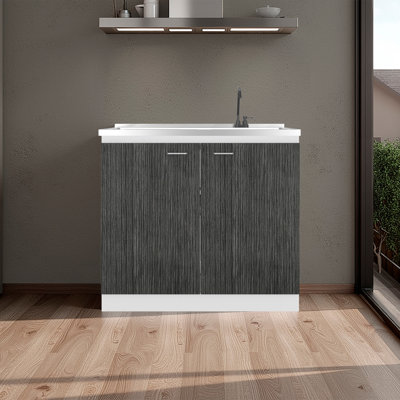Évier utilitaire avec robinet intégré Napoles, comptoir intégré en acier inoxydable, armoire autoportante avec deux portes, poignées en métal et deux tablettes intérieures, gris et blanc