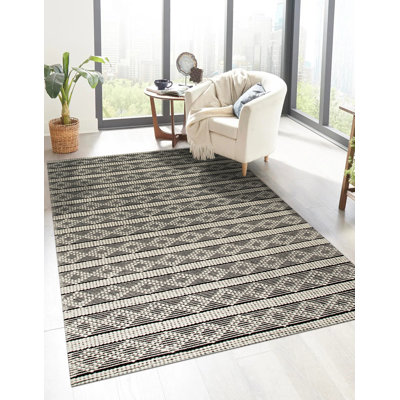 Tapis rayé noir en laine fabriqué à la main Selene
