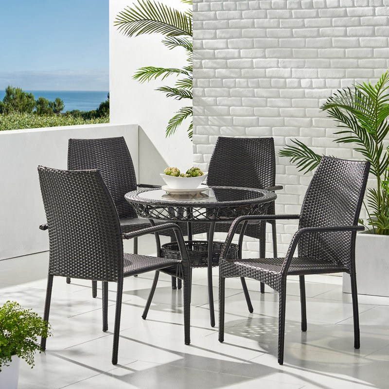 Donahoe 4 - Person Wicker Patio Dining Set with Round Table