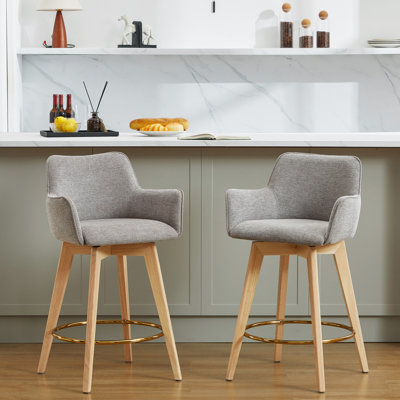 Tabouret de comptoir Wylee de 25,8 po de hauteur à dossier pivotant avec structure en bois d'hévéa massif et repose-pieds doré