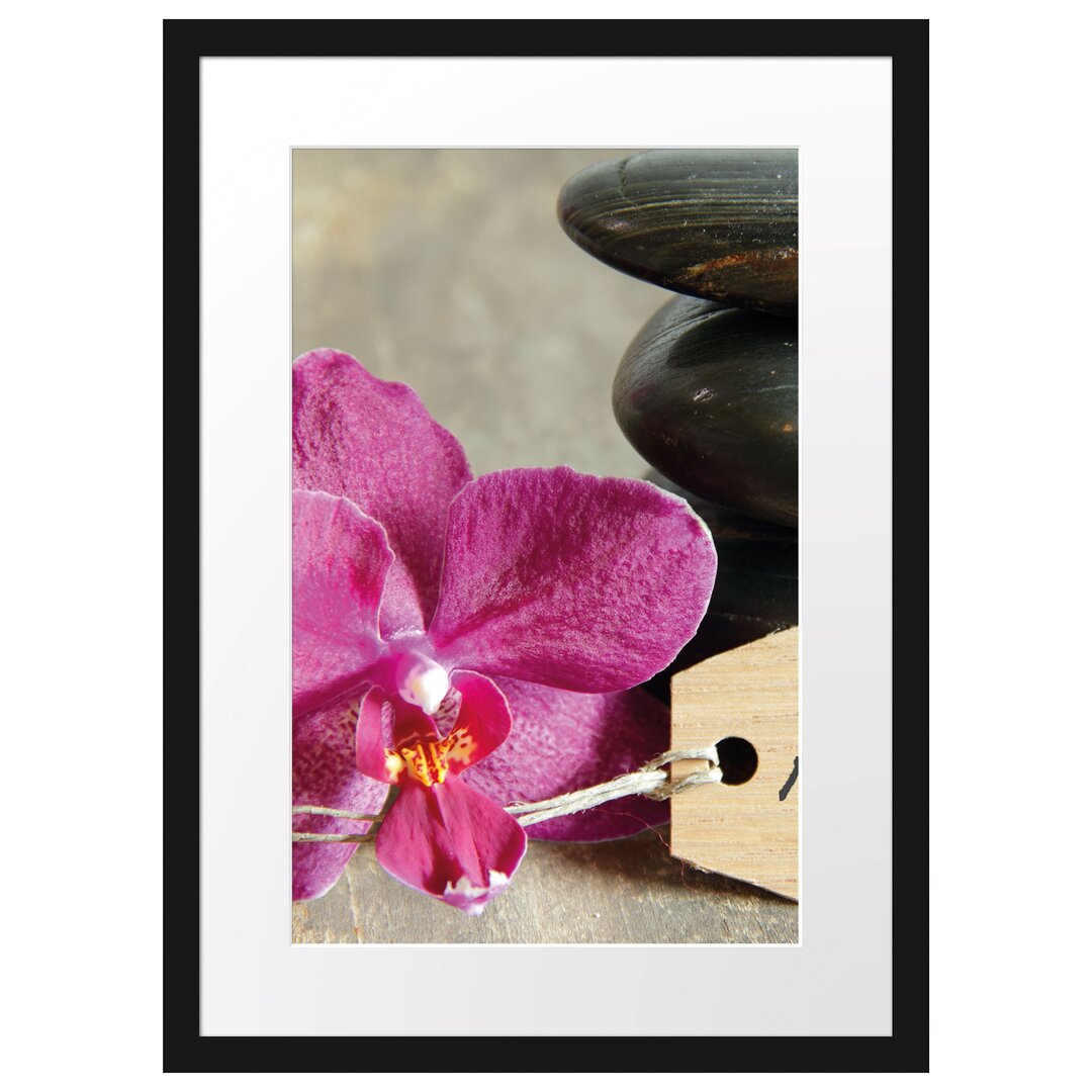 Gerahmtes Poster Auszeit Orchidee mit Zen Steinen