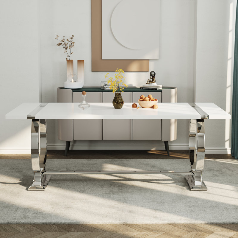 Table de salle à manger de luxe moderne avec plateau rectangulaire laqué brillant et base circulaire en acier inoxydable