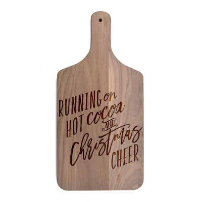 Courir sur une planche à découper chaude cacao et Noël