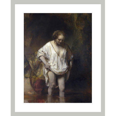 «Woman Bathing in a Stream» par Rembrandt van Rijn - Reproduction giclée encadrée