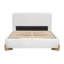 Élégant lit tapissier avec pieds en bois massif naturel, centre de chambre luxueux et confortable
