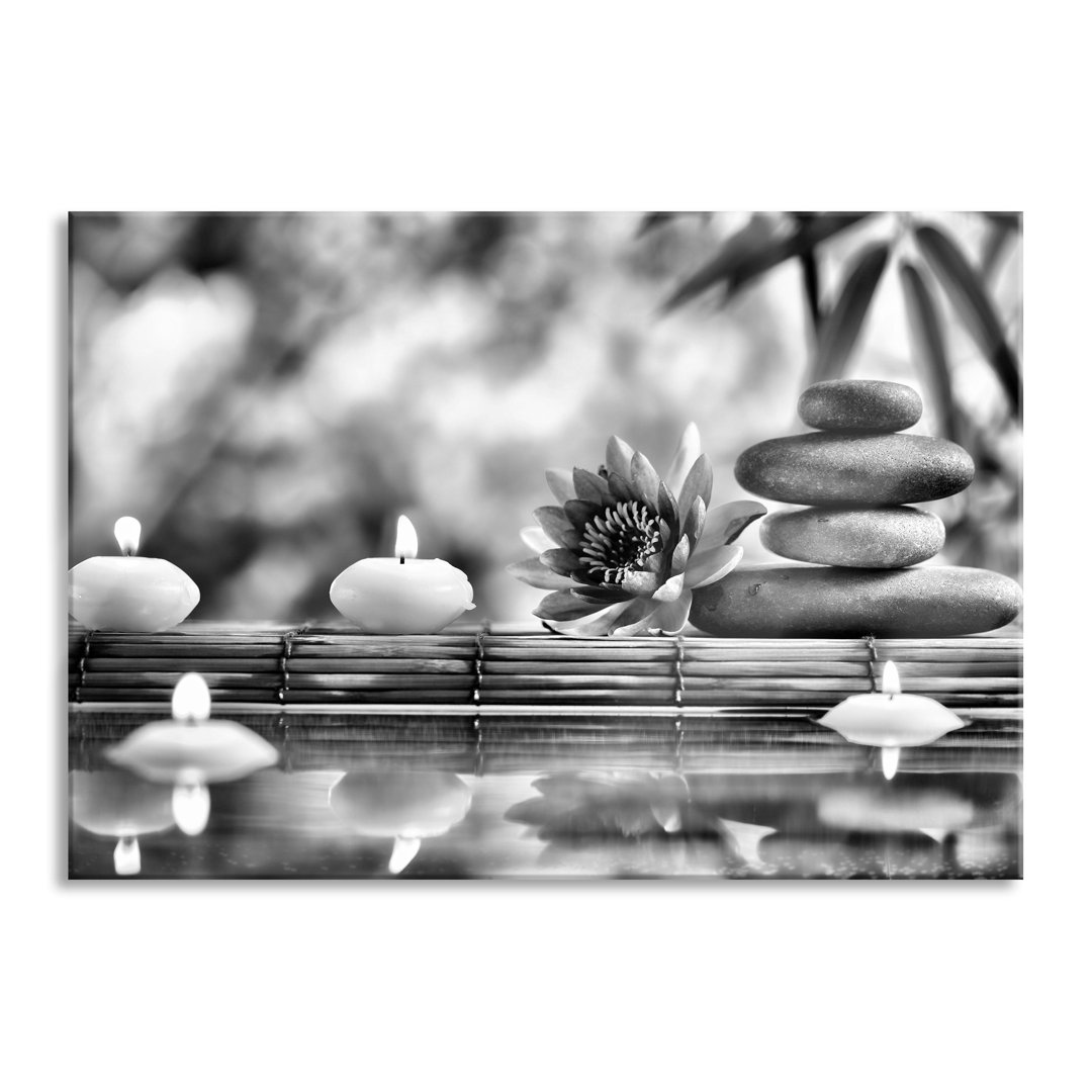 Glasbild Seerose mit Zen-Steinen im Tempel