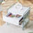 Bedside table with drawers. The board surface is MDF with white grain sticker, and both sides are transparent tempered glass. The design is simple and elegant, with excellent storage functions.