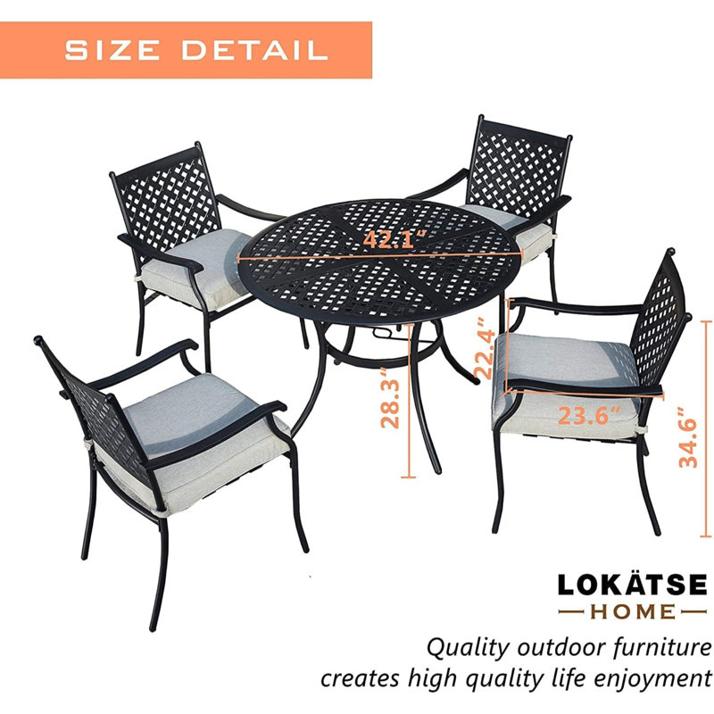 Rhyanne 4 - Person Patio Dining Set with Round Table , Cushions Included