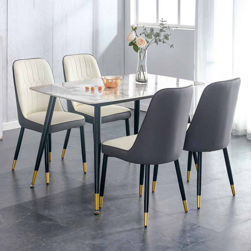 Ensemble de table et de chaises 48,4 x 28 pouces en pierre frittée blanche - 4 chaises de salle à manger en polyuréthane épissé blanc et gris foncé.