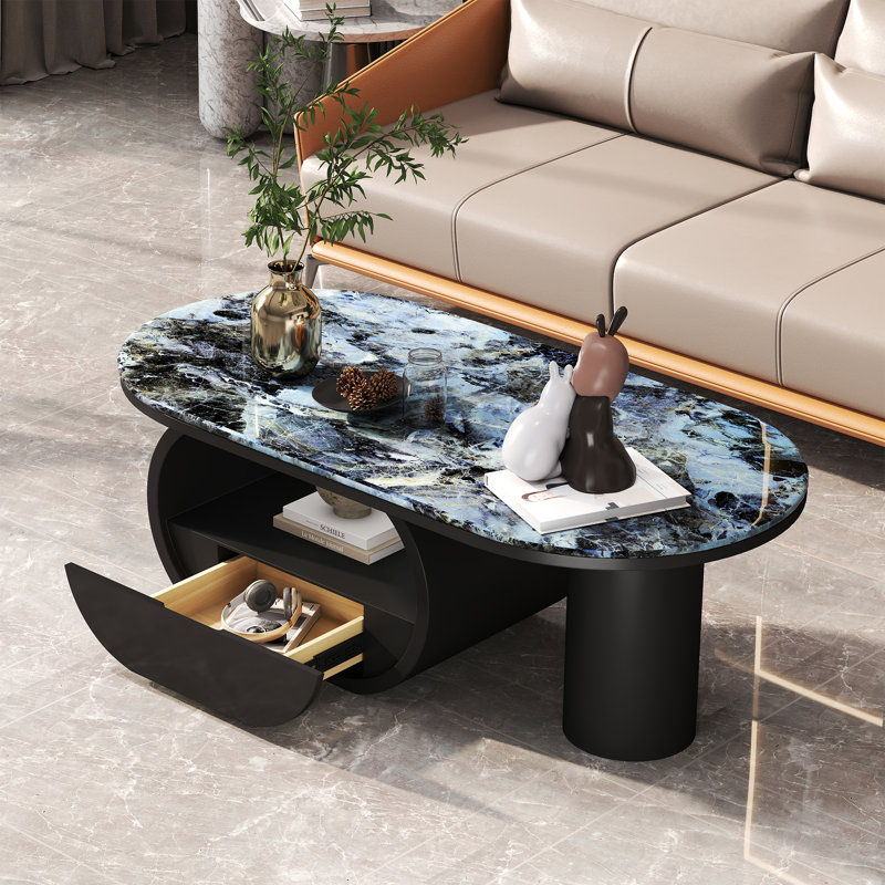 Winchester 47.24'' W Oval Stone and Faux Marble Coffee Table with Iron Base, Blue/Black