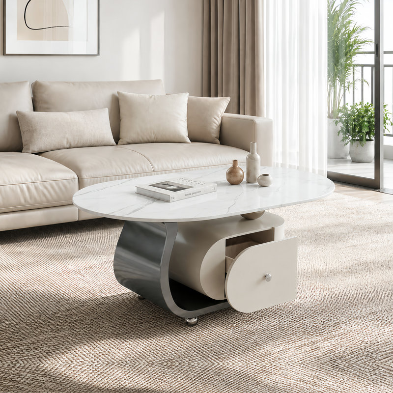Table basse ovale moderne de 39,4 po avec rangement, plateau en pierre frittée et roulettes verrouillables, Blanc / argenté