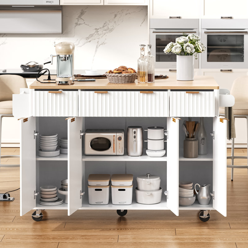 Fluted Kitchen Island with Storage, 55.5" Kitchen Island with Drop Leaf, Power Outlet, 4 Doors and 3 Drawers, Rolling Island Table with Wood-grain Top, Curved Edge for Kitchen,Dining Room White