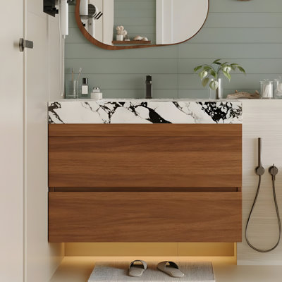 Meuble-lavabo de salle de bain avec comptoir en faux marbre et lavabo encastré en céramique