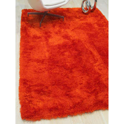 Tapis orange en laine touffeté à la main