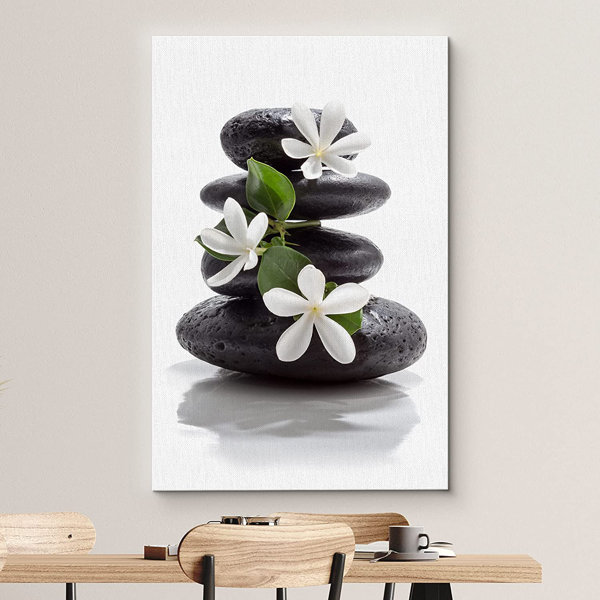 https://assets.wfcdn.com/im/92700738/resize-h600-w600%5Ecompr-r85/1902/190270260/Zen+Stones+Basalt+With+Calming+Plumeria+Flowers+On+Canvas+Print.jpg