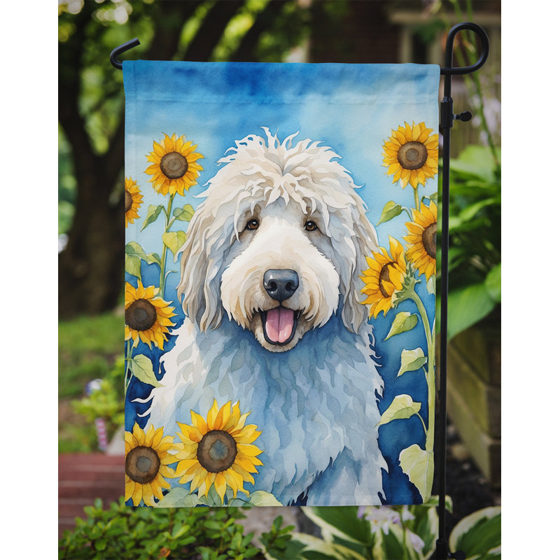 Lévrier irlandais dans le drapeau du jardin de tournesols, Komondor
