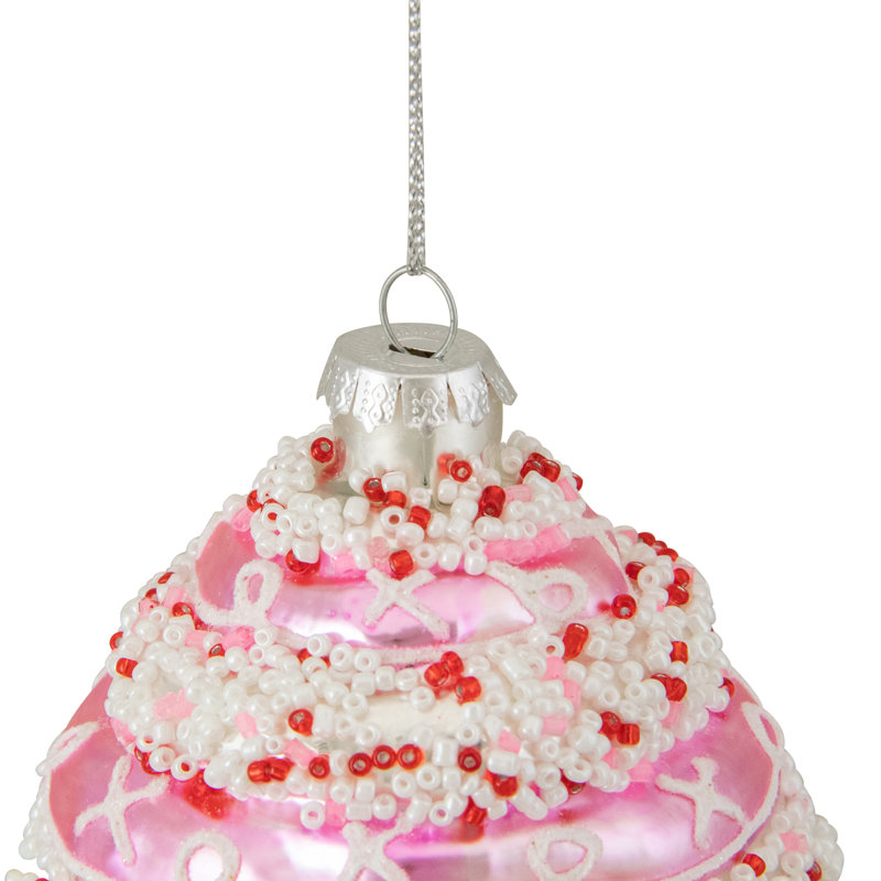 Ornement de Noël en forme de petit gâteau rose et blanc 4 po avec paillettes