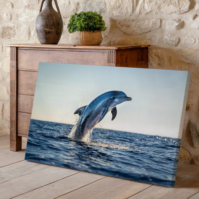 Canvas A Vibrant Scene Captures A Sleek Dolphin Leaping Gracefully Above Wall Art The Sparkling Ocean Surface With Splashes Of Water Canvas Wall Art