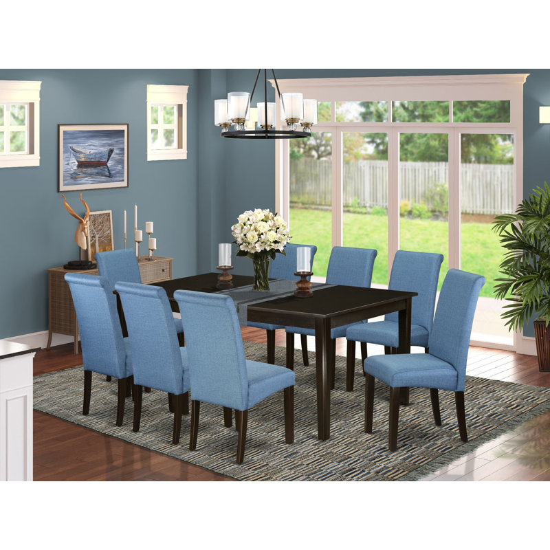 Cet ensemble de salle à manger 9 pièces comprend une table de cuisine rectangulaire avec piédestal et 8 chaises Parson en tissu de couleur bleue, cappuccino de 42 po x 72 po