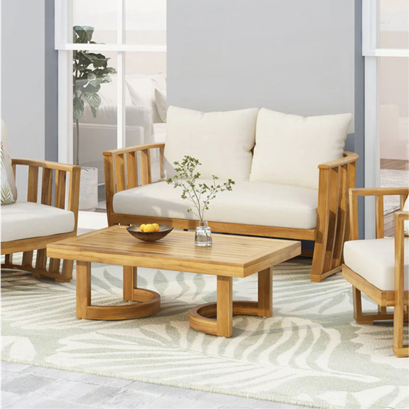 Ensemble de causeuse et table basse d'extérieur en bois d'acacia avec coussins