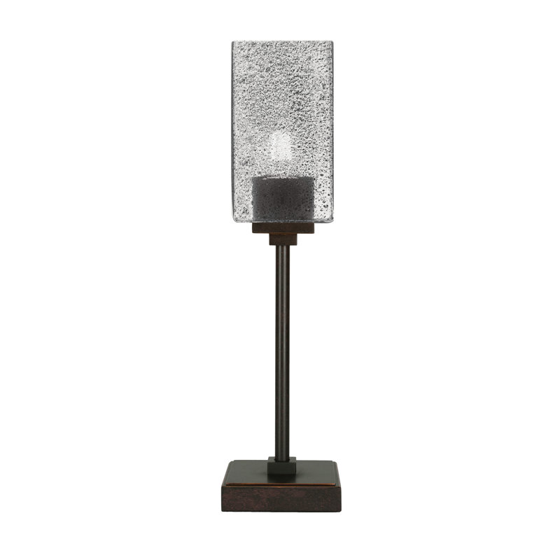 Lampe d'appoint Luna présentée en finition granit foncé avec verre à bulles fumée carré de 3,5 po